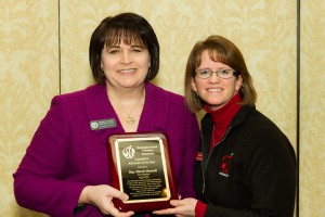 Olympia High School counselor Kim Reykdal presenting Marcie with the WSCA "Legislative Advocate of the Year" award. 