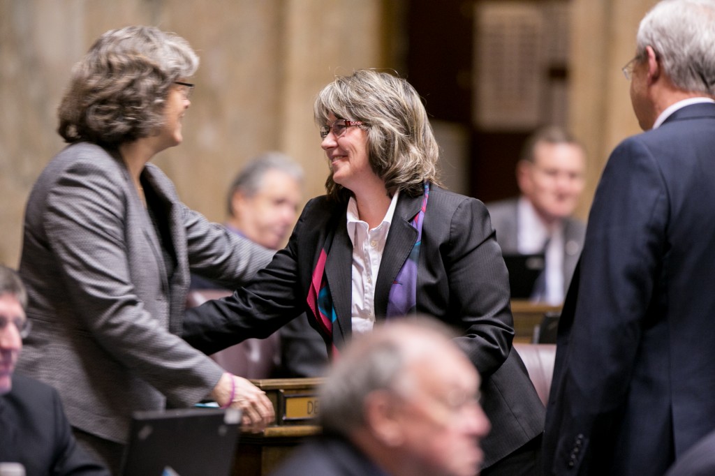 Rep. Tarleton is congratulated by fellow lawmakers after passing her first bill, HB 1647, from the House of Representatives. HB 1647 would require landlords to safely secure spare keys to rental units.