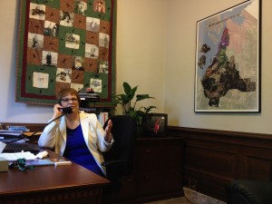 Rep. Tami Green in her office being interviewed by KIRO about mental health reforms and House Bill 1777. 