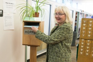 Rep. Joan McBride dropping legislation into the Hopper Legislative Support Services