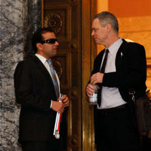 Reps. Cyrus Habib and Hunter having a brief discussion outside of the House chambers at the state capitol.