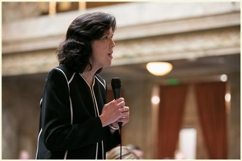  Rep. Christine Kilduff speaking on the floor of the House on National Guard Day