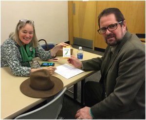 Ellen Gray, Executive Director of WSFFN handing me a small package with pea seeds that that reads, “The Good Food Coalition asks that you PEAS help local farms grow healthy kids.”