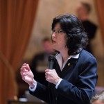 Christine Kilduff on floor regarding gold star kids