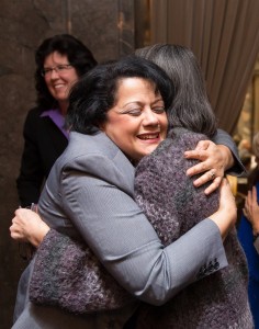 Reps. Lillian Ortiz-Self and Sharon Tomiko Santos embrace after HB 1541 wins approval in the Senate.