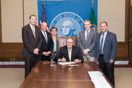 Marcus Riccelli at bill signing with Governor Inslee for HB 2432 substance abuse monitoring