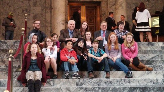 Boys and Girls Club members with Rep. Kevin Van De Wege inside the state capitol.