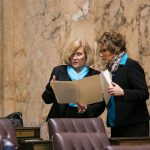 Rep. Wylie discussing legislation with Rep. Liz Pike on first day of Session