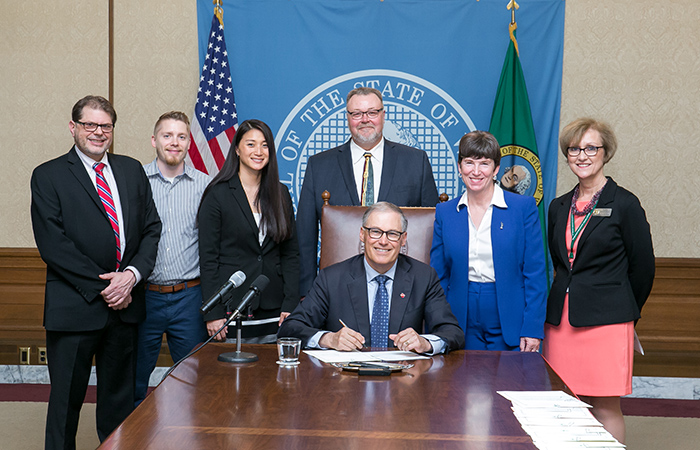 Gov. Inslee signs Substitute House Bill No. 1521, May 4, 2017. Relating to removing the requirement that an employee must work at least six months before taking vacation leave. Primary Sponsor: Laurie Dolan