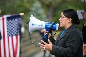 Reeves speaking to a rally with Mockingbird Society