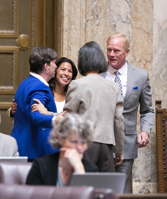 From L-R: Reps. Laurie Dolan (D-Olympia), Monica Stonier (D-Vancouver), Sharon Tomiko Santos (D-Seattle), and Paull Harris (R-Vancouver) celebrate passage of HB 2224 by the House of Representatives.