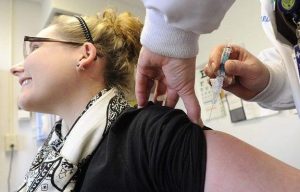 Woman receiving vaccine