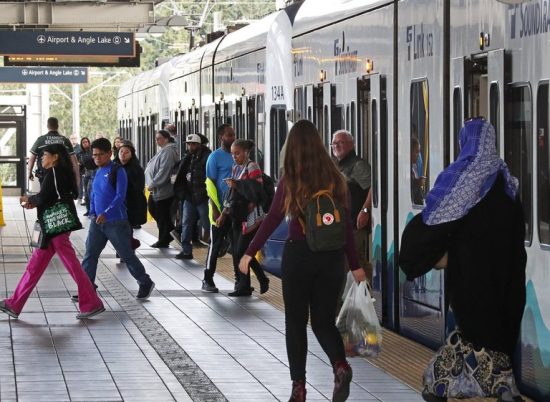 Late afternoon commuters arrive at the Tukwila International Boulevard light-rail station on Sept. 11