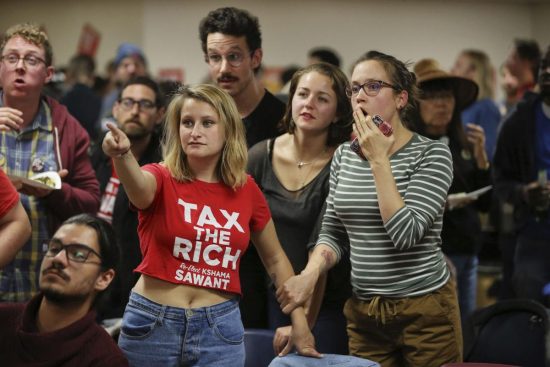 Supporters of Seattle City Council District 3 incumbent candidate Kshama Sawant react as results come in.