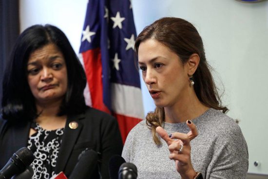 Rep. Pramila Jayapal, D-Wash., left, looks on as Negah Hekmati speaks about her hours-long delay returning to the U.S. from Canada with her family days earlier during a news conference Monday in Seattle. 