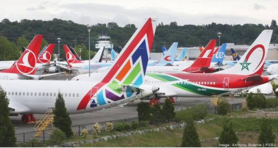 Dozens of Boeing 737s including Max 8 models, sit lined up grounded near the commercial airplane's manufacturer's facilities in Tukwila, Washington, May 20, 2020.