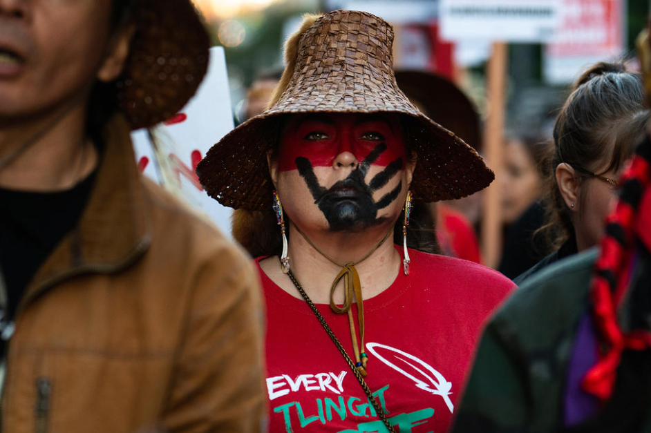 A supporter of the Washington State Missing and Murdered Indigenous Women and People Task Force marches alongside fellow protesters in downtown Seattle on Thursday, October 4.