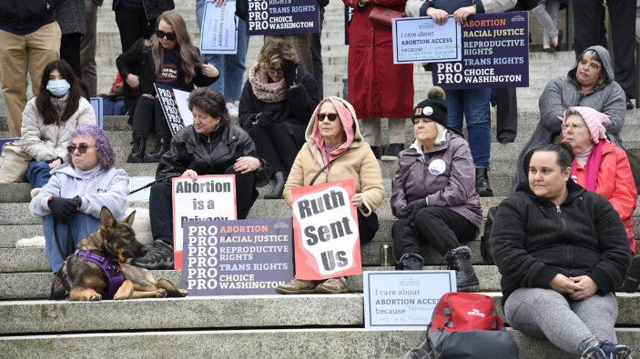 Abortion rights activists rally outside Washington’s Legislative Building in Olympia on Tuesday as Senate committees heard testimony on a package of bills aimed at protecting reproductive rights.