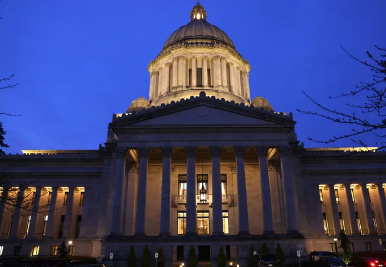 The Washington state Legislative Building lit up at twilight at the Capitol in Olympia in mid-January.