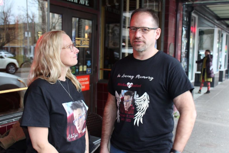Amber (left) and David (right) Weilert share the story of losing their son, Michael, pictured on their shirts. He was killed by a driver at age 13.