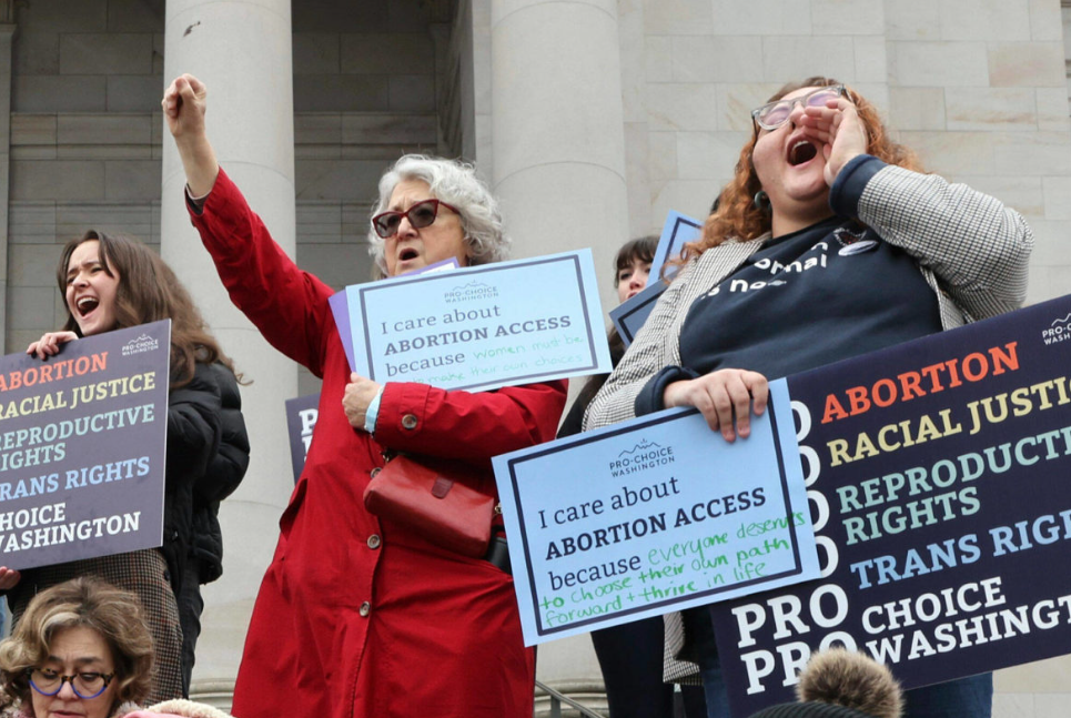 People cheer Jan. 24 during an abortion rights rally at the State Capitol in Olympia.