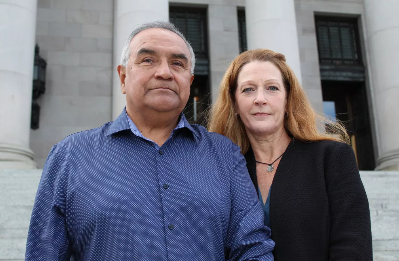 Hector Martinez and Jolayne Houtz, parents of Sam Martinez, in front of the Legislative Building in Olympia in March 2022.
