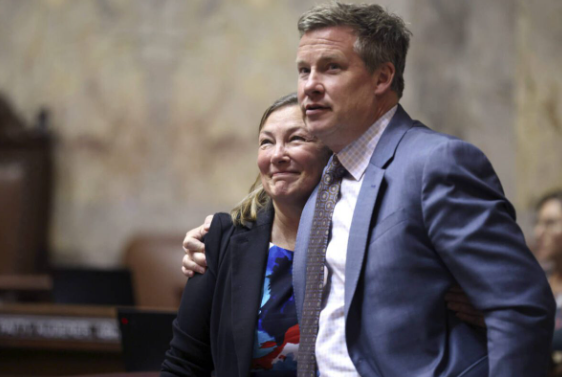 Sen. June Robinson, D-Everett and Sen. Mark Mullet, D-Issaquah embrace after a special session called to resolve the state’s drug possession law on Tuesday, in Olympia. Robinson was primary sponsor of the legislation.