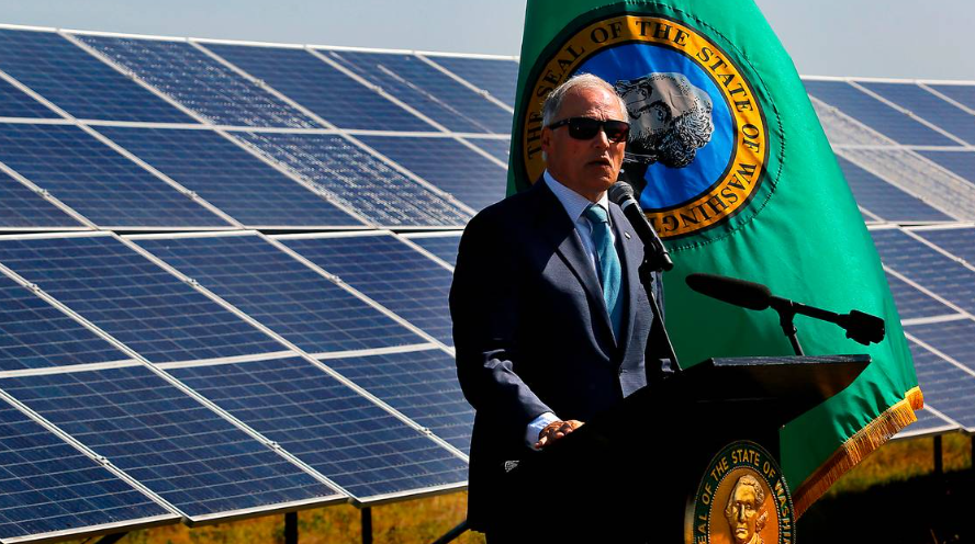Washington Gov. Jay Inslee prepares to sign a series of climate action bills Wednesday morning at the Horn Rapids Solar Farm, a collaborative solar energy, storage and training facility in Richland.