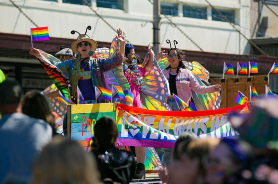 A float full of people dressed as butterflies crawls past thousands celebrating on First Street during Snohomish’s inaugural Pride celebration on June 3, in downtown Snohomish