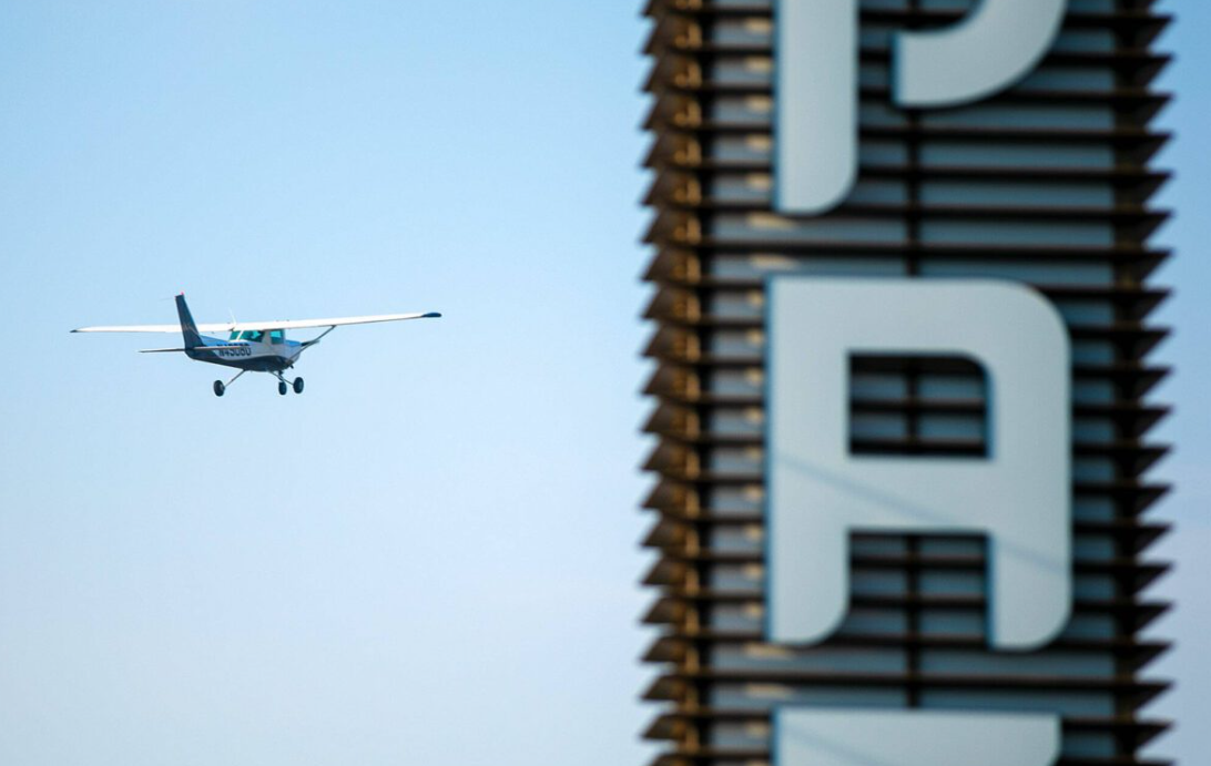 A 1979 Cessna 152 takes off from Paine Field and flies past the airport’s sign on Thursday, Oct. 13, 2022, in unincorporated Snohomish County, Washington.