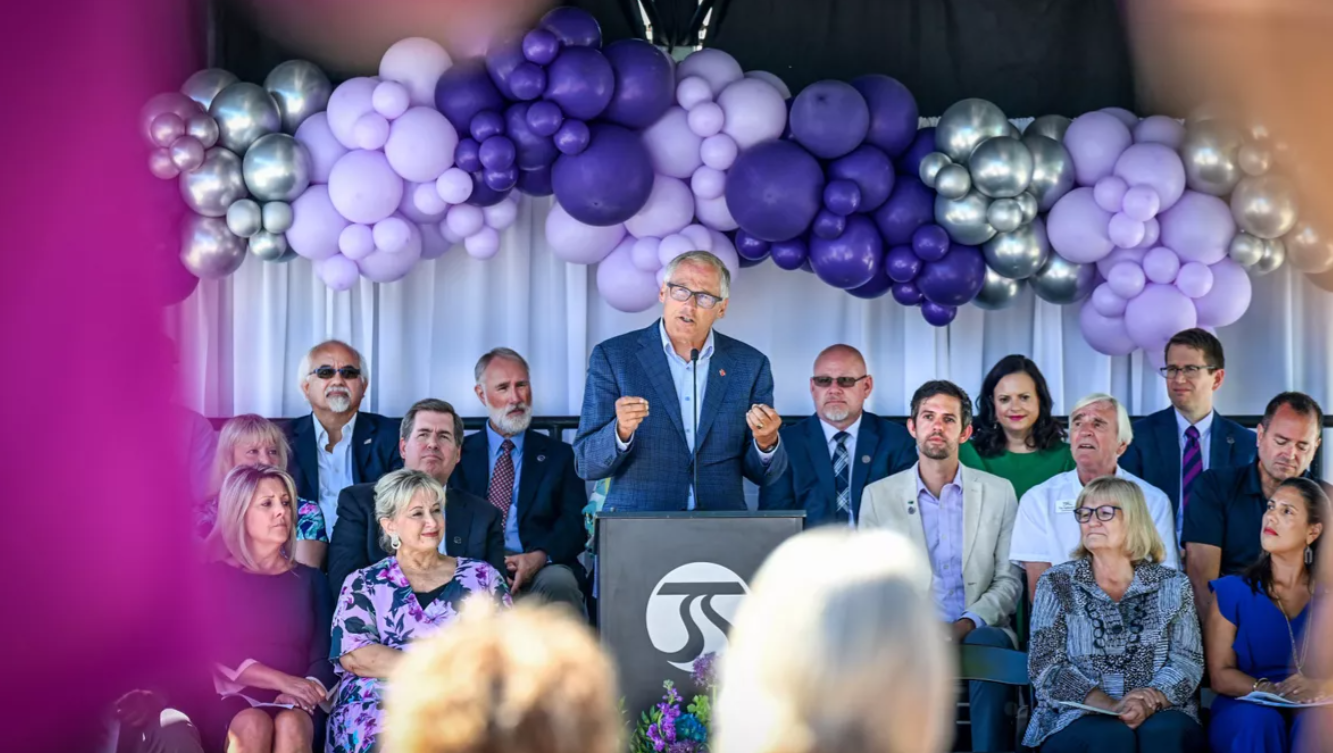 Gov. Jay Inslee addresses the crowd gathered for the City Line ribbon-cutting ceremony Tuesday at the corner of Cincinnati Street and Desmet Avenue on the Gonzaga University campus.