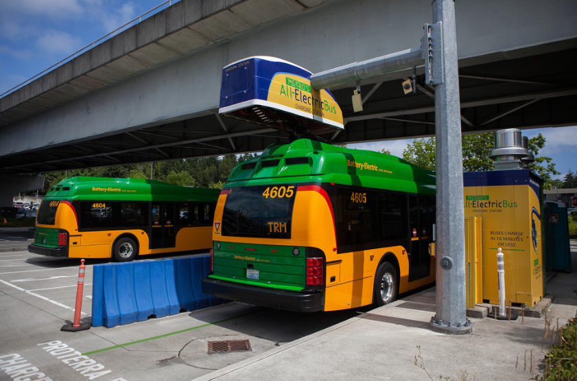 From an August 2018 file photo, a King County Metro battery bus at the charging station at Bellevue's Eastgate Transit Center.