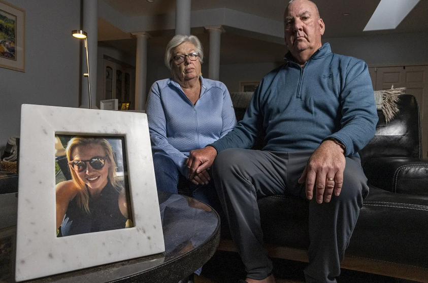 A portrait of Andrea Churna is displayed in the home of her parents, Margaret and Michael Thomas, on Dec. 14, 2021. Michael Thomas, a retired Michigan State Police commander who investigated or oversaw investigations into dozens of police shootings and homicides during a 32-year career, is incredulous that criminal charges weren’t filed in his daughter’s death.