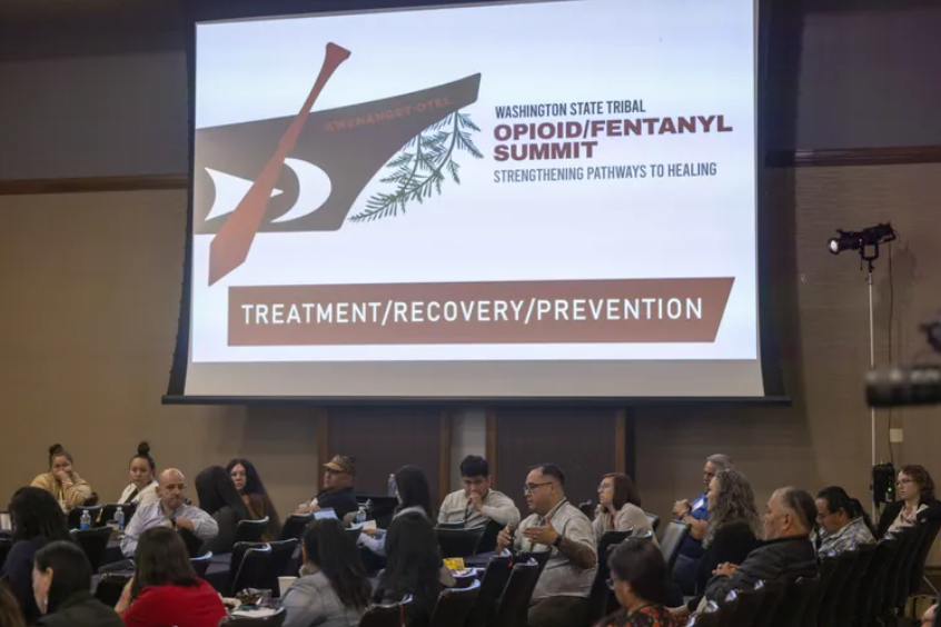 Shad St. Paul, center right, director of behavioral health for the Spokane Tribe, addresses the Washington State Tribal Opioid/Fentanyl Summit in May.