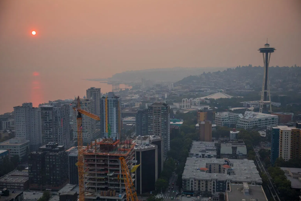 A look at the Seattle skyline and Space Needle through the smoke due to the wildfires on Aug. 20, 2023.