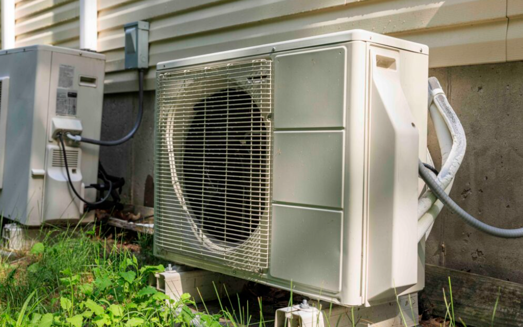 Washington state regulators want builders to install electric heat pumps, like the one pictured above, in new homes.
