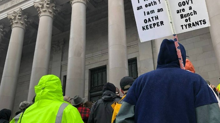 Visitors and Oath Keepers open carry weapons at the state capitol on Jan. 31, 2020 during a rally. Legislation passed in 2021 now prohibits weapons within 250 feet of state capitol grounds and permitted demonstrations.