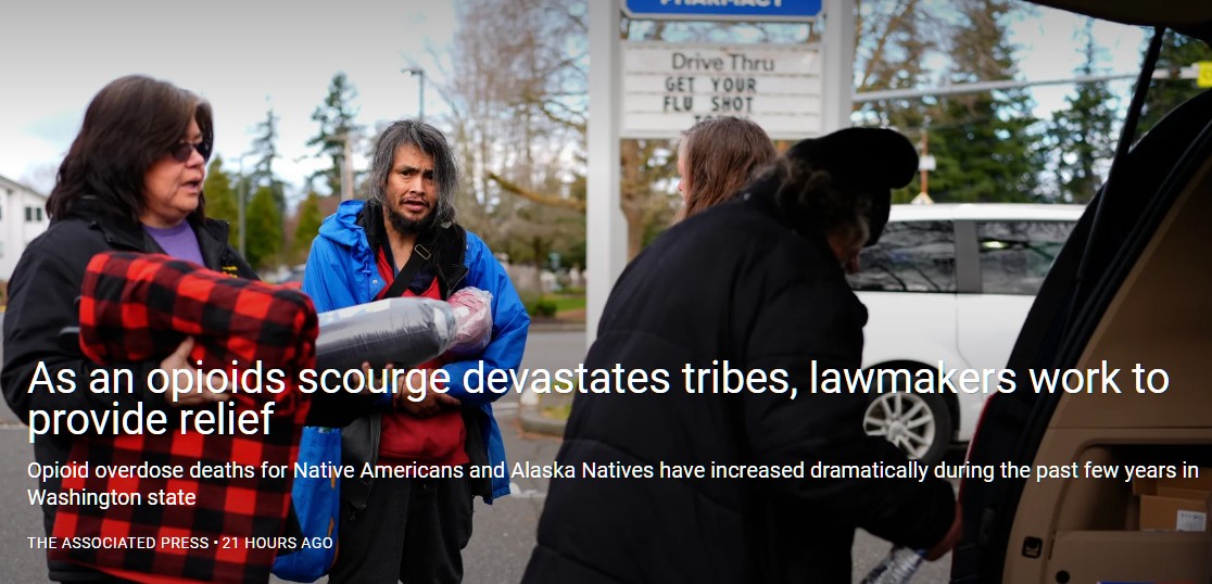 Lummi Nation crisis outreach supervisor Evelyn Jefferson, left offers supplies to tribal citizens experiencing homelessness like Jason Billy, second from left, and Rodney Julius, front right, Thursday, Feb. 8, 2024, in Bellingham, Wash. The Lummi Nation declared a state of emergency due to the fentanyl crisis in 2022. Washington State tribal leaders are urging state lawmakers to pass a bill that would send at least $7.75 million in funding to tribal nations to help them stem a dramatic rise in opioid overdose deaths