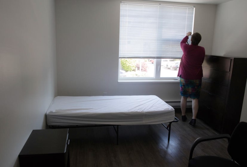 Director of Programs Rachel Mathison in a second floor bedroom for homeless youth at Cocoon House in Everett, May 24, 2019. Cocoon House offers a small handfull of long-term housing beds for homeless youth.