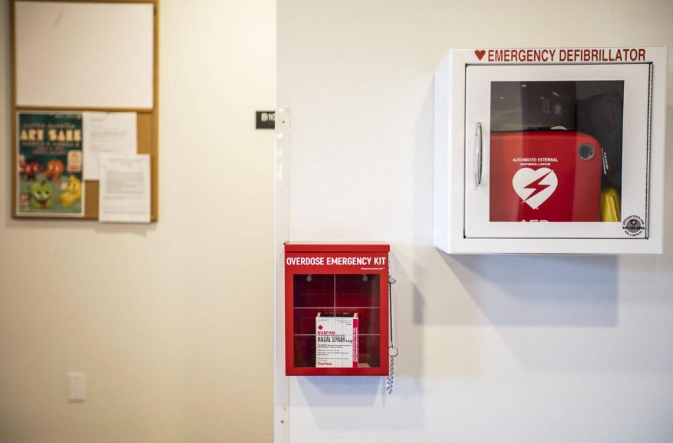 An emergency overdose kit with naloxone located next to an emergency defibrillator at Mountain View student housing at Everett Community College on Tuesday, March 5, 2024 in Everett, Washington.
