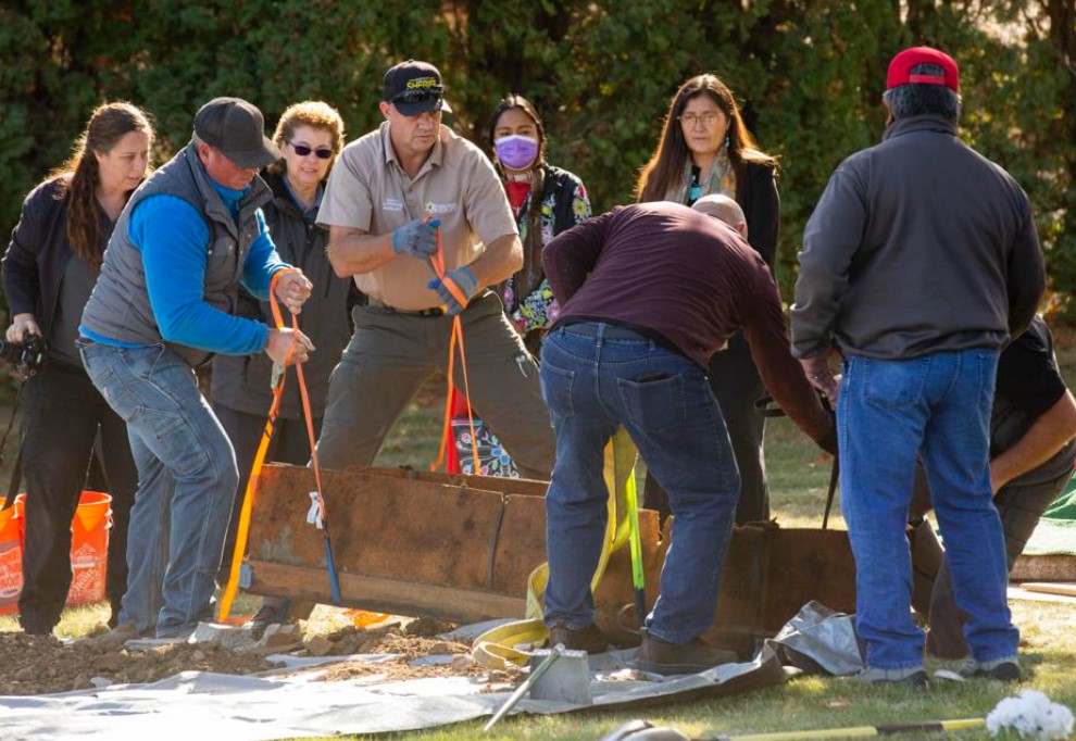 The coffin containing the remains of the person believed to be Parker Doe is lifted from the ground at West Hills Memorial Park Thursday, Oct. 14, 2021 in Yakima, Wash.