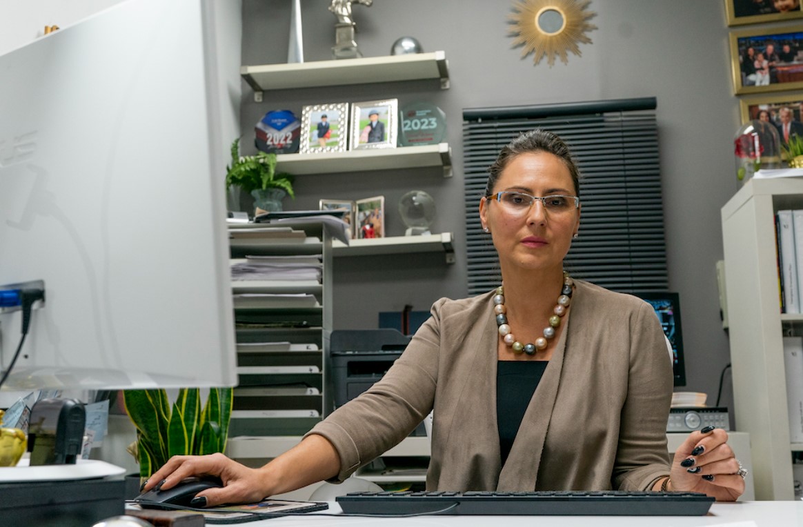 Dorota Mani sits at her desk in her Jersey City, N.J., office in November 2023. Mani’s teenage daughter was victimized by an AI-generated deepfake image last year. Peter K. Afriyie