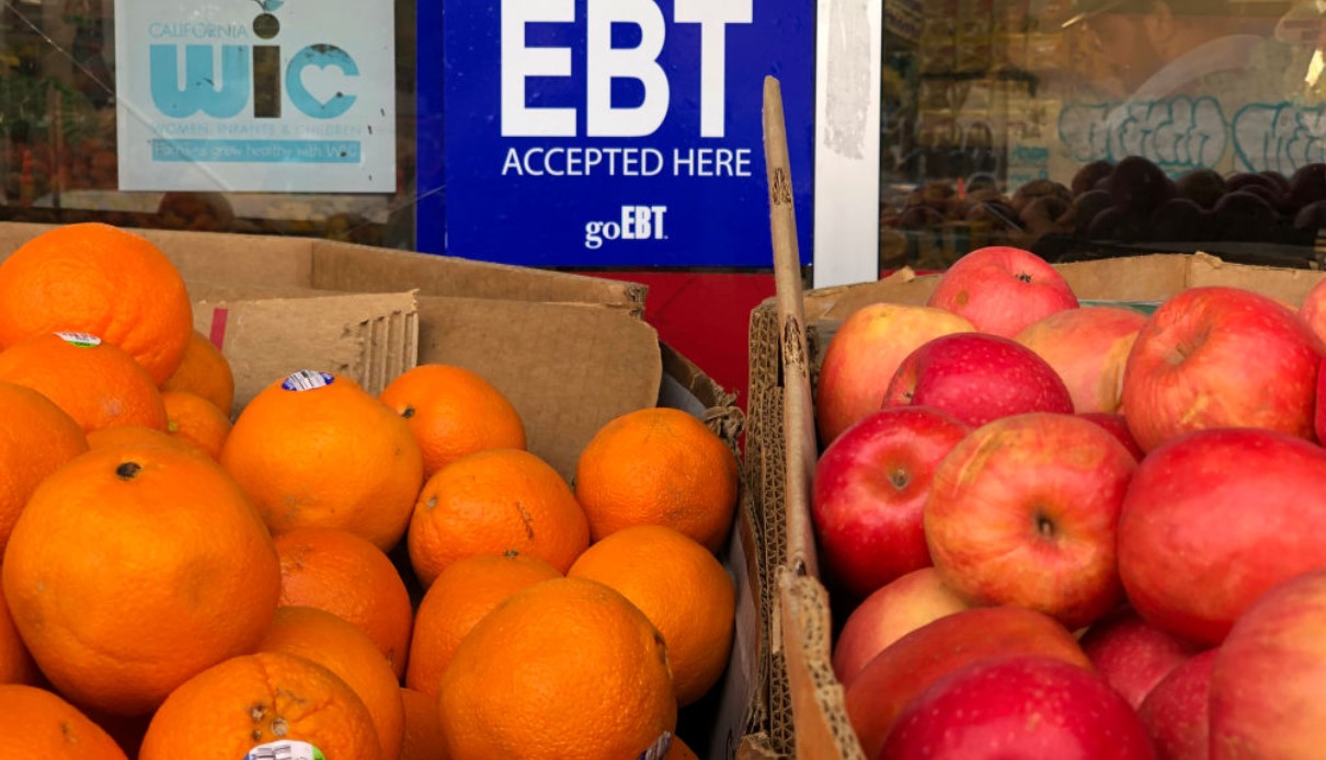 A sign noting the acceptance of electronic benefit transfer (EBT) cards that are used by state welfare departments to issue benefits is displayed at a grocery store on December 04, 2019 in Oakland, California.