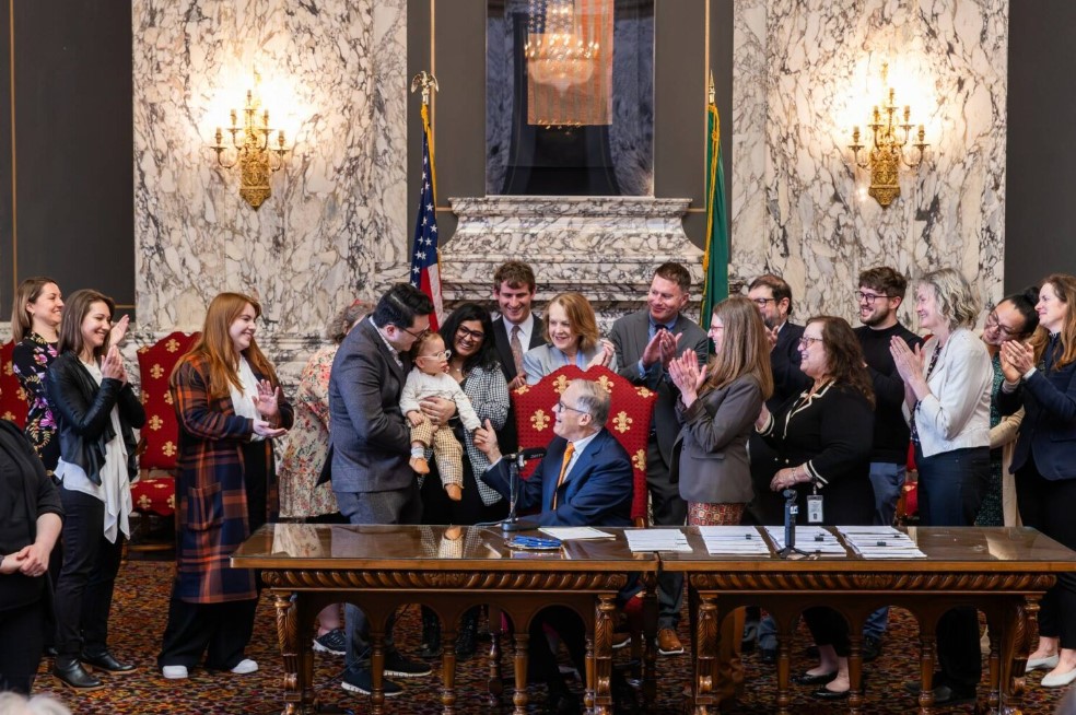 Washington Gov. Jay Inslee signs House Bill 1240, which prohibits the manufacture, importation, distribution and sale of AR-15s and similar semi-automatic weapons, on April 25, 2023, at the state Capitol in Olympia.