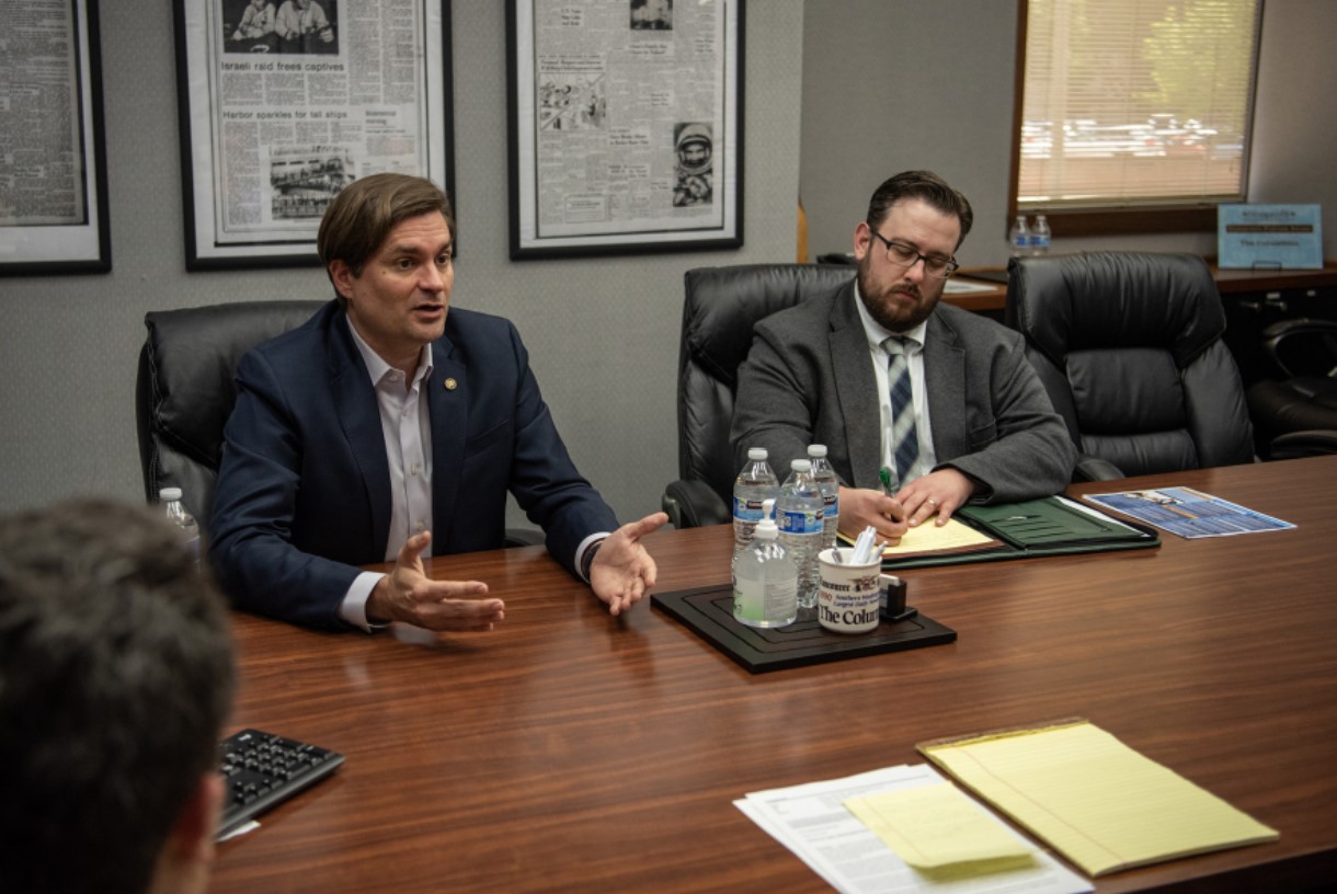 Washington State Treasurer Mike Pellicciotti, left, and his office’s communications director, Aaron Sherman, speak with The Columbian’s editorial board about Washington Saves. (Taylor Balkom/The Columbian)