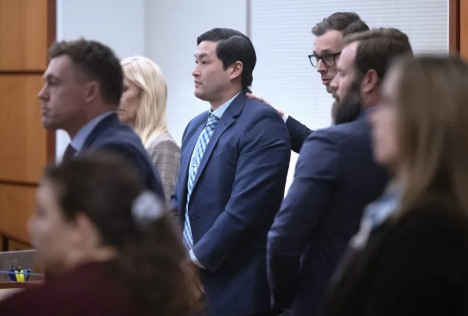 Tacoma police Officer Timothy Rankine stands with attorney Mark Conrad as jury questions are answered in Pierce County Superior Court in Tacoma. (Tony Overman / pool photo via The News Tribune, 2023)