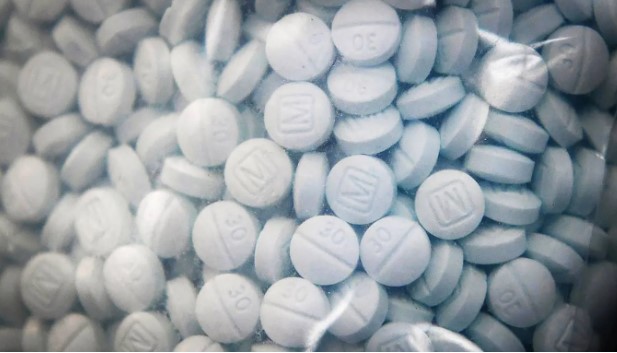 A bag of evidence containing the synthetic opioid fentanyl disguised as Oxycodone in 2020 in California. Photo: Craig Kohlruss/The Fresno Bee/Tribune News Service via Getty Images