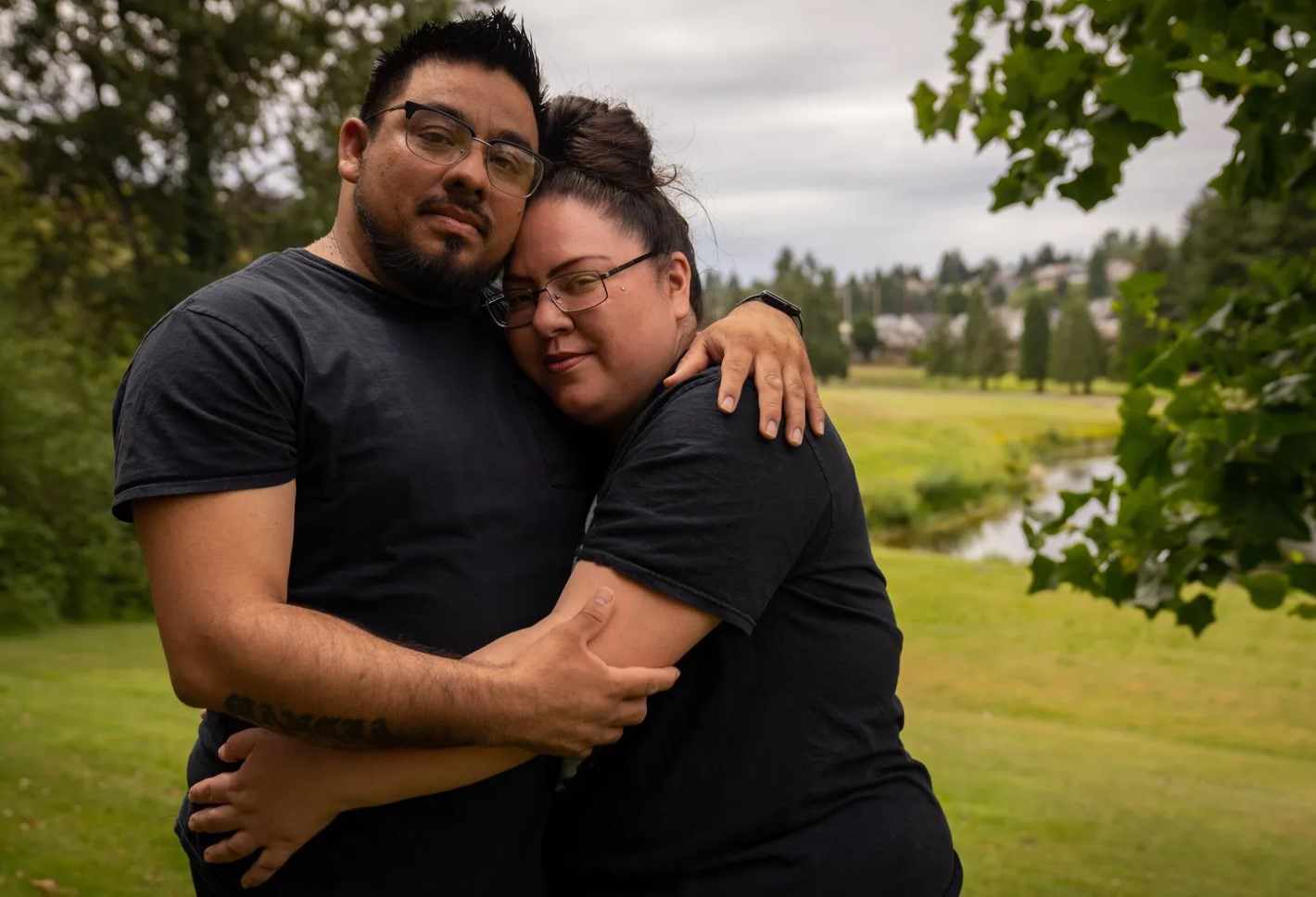 Jarold Mancia and his wife Carleigh pose for a portrait outside of their Tacoma home, where they are raising four children. The couple hope an executive order by President Joe Biden will provide legal status to Jarold, a former police officer in El Salvador who came to the country unlawfully. “It opens a lot of doors for... (Audrey Richardson / The Seattle Times)