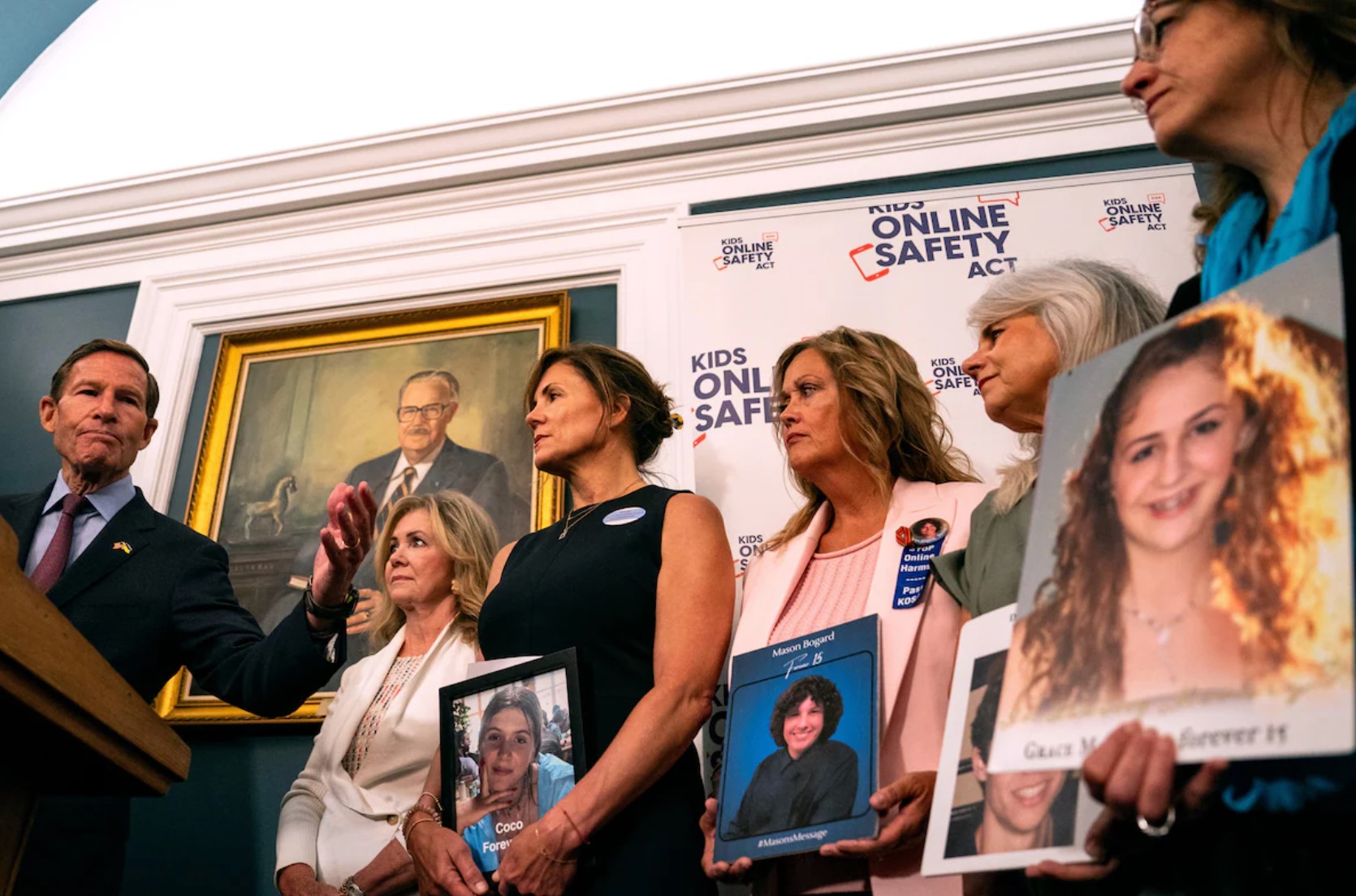 Sens. Richard Blumenthal (D-Conn.) and Marsha Blackburn (R-Tenn.) speak alongside families of victims of online abuse at a news conference on Capitol Hill for the Kids Online Safety Act on Thursday. (Kent Nishimura/Getty Images)