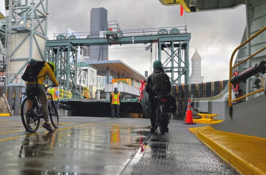 A small group of walk-on passengers wait to disembark the Bremerton-to-Seattle ferry, a sign of dwindling walk-on ridership post-pandemic. (Travis Merrigan)